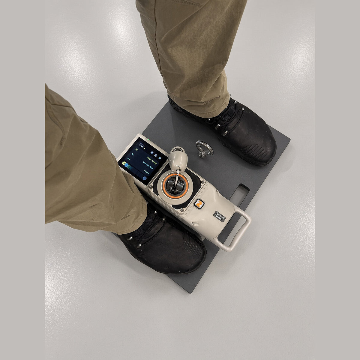 User standing on the Travel Platform with a VOLTRA I docked between their feet